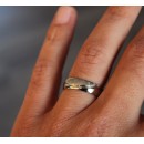 Pair of stainless steel wedding rings with satin silver engraving.