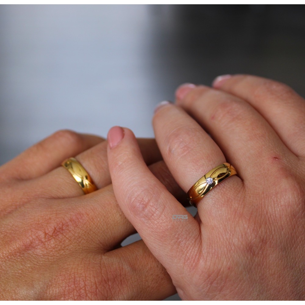 Steel and Gold Engagement Rings with...