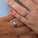 Couple of simple engagement rings made of steel with engraving