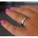 Pair of thin, satin-finished steel engagement rings in silver