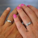 Pair of thin, satin-finished steel engagement rings in silver