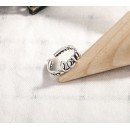Adjustable women's 925 silver ring with the word "love" written on it.