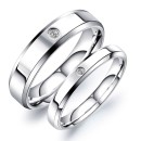 Couple of simple engagement rings made of steel with engraving