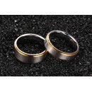 Couple of engagement rings in steel with band and engraving