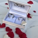 Couple of simple engagement rings made of steel with engraving